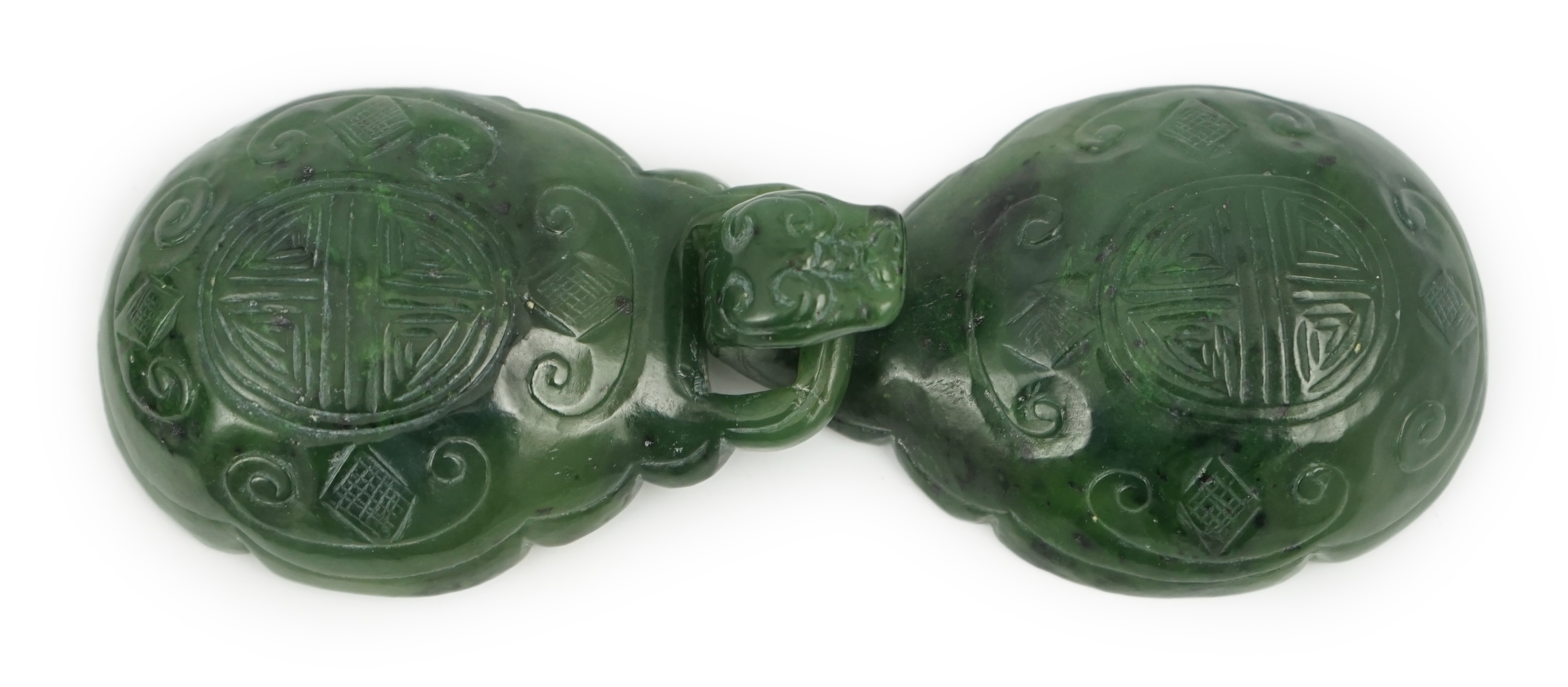 A Chinese spinach green jade two-piece belt buckle, 18th/19th century